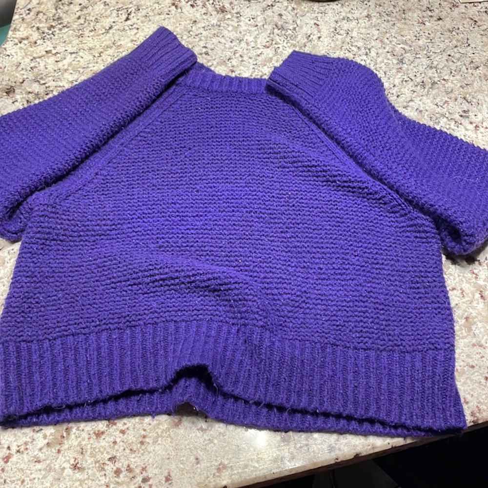 This is a crop sweater, dark purple and a size large.
